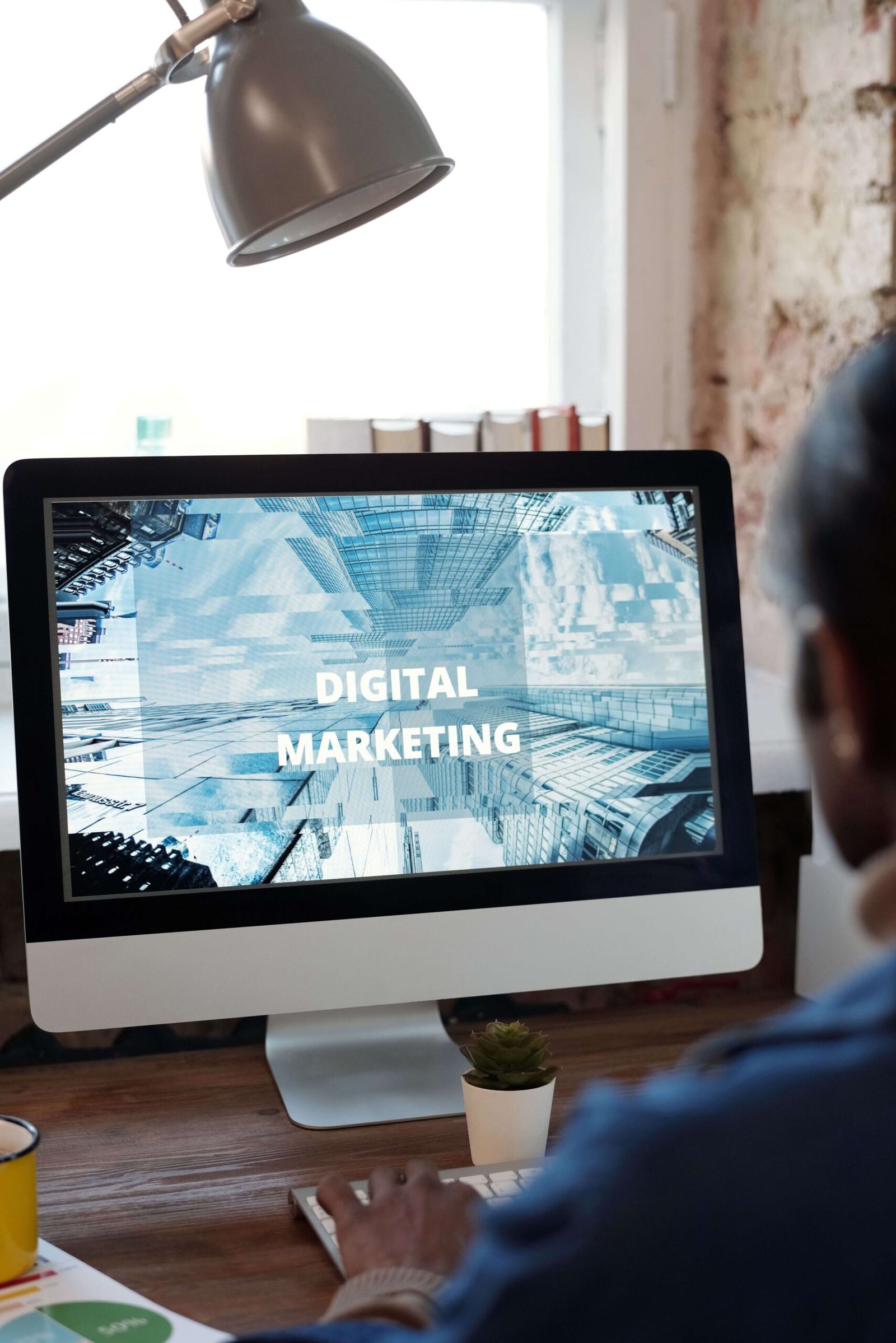 Person working on a laptop displaying a digital marketing concept
